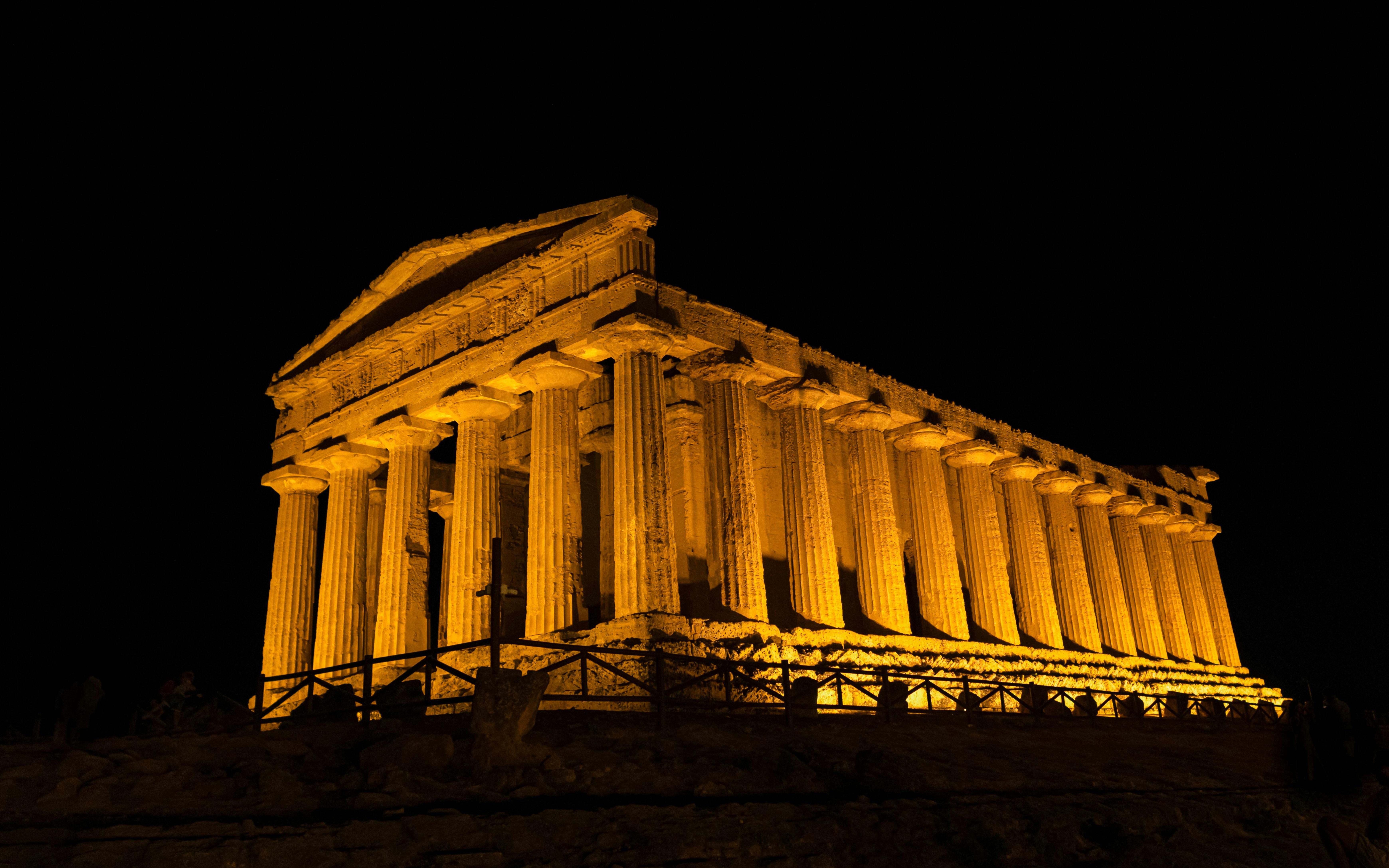 Illuminated Greek temple ruin at night, Valley of the Temples, Agrigento, Sicily.