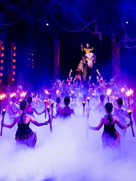 Dancers with torches performing at Phuket Fantasea stage show.