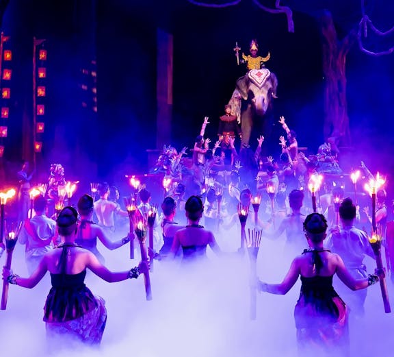 Dancers with torches performing at Phuket Fantasea stage show.