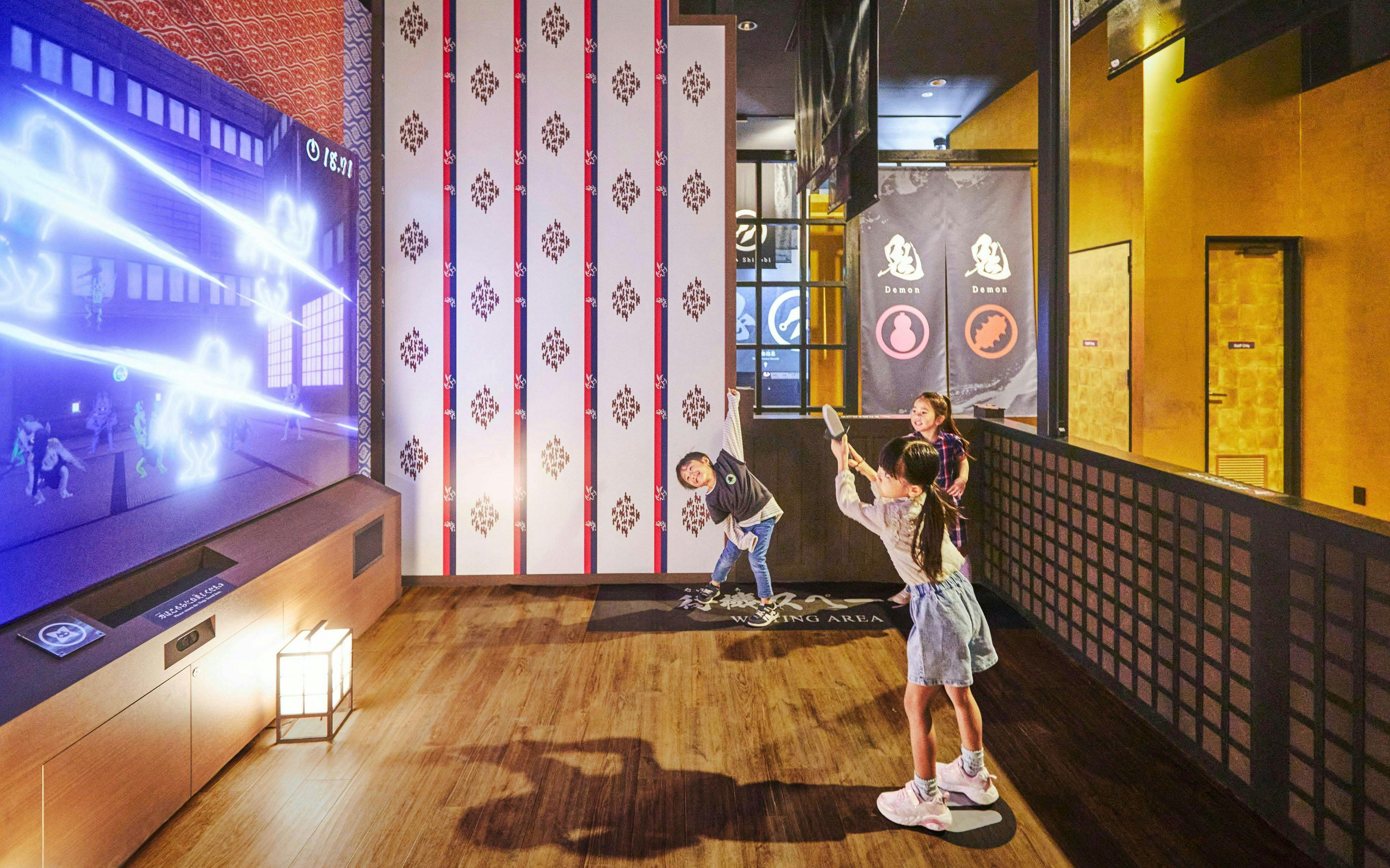 Children playing interactive game at TOEI Kyoto Studio Park.
