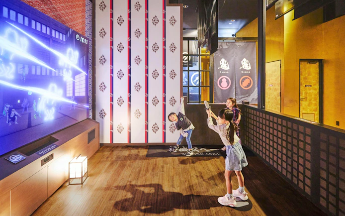 Children playing interactive game at TOEI Kyoto Studio Park.