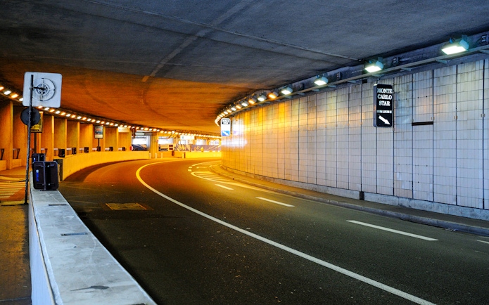Monte Carlo tunnel illuminated at night during guided tour from Nice.
