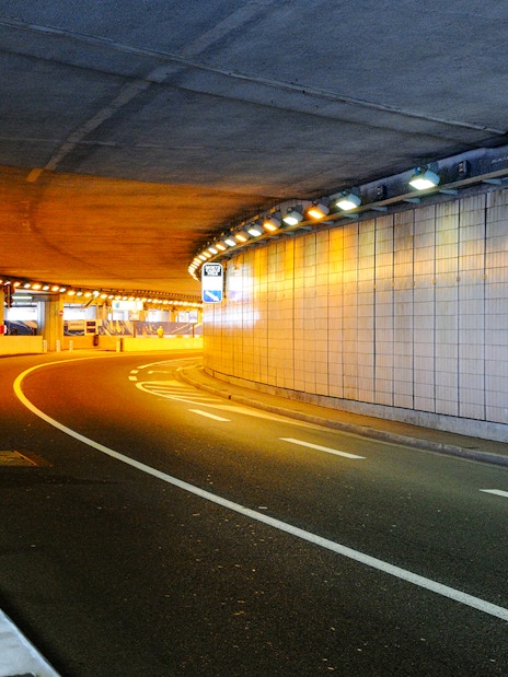 Monte Carlo tunnel illuminated at night during guided tour from Nice.