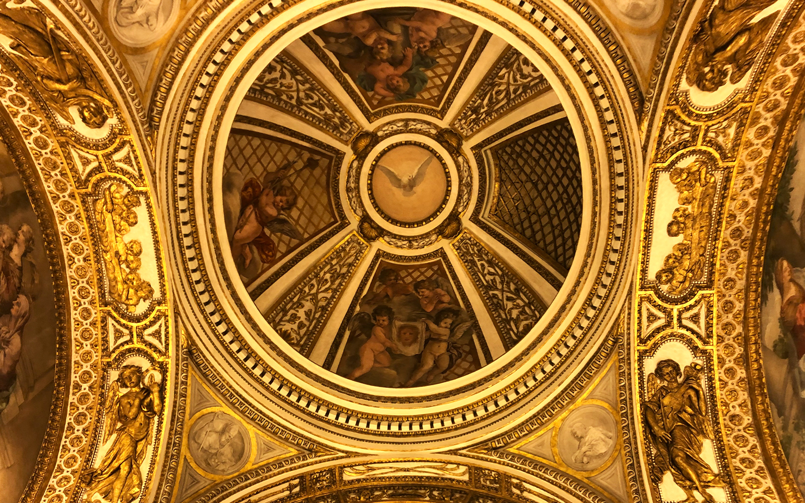 Ceiling artwork with cherubs and gold details at Palazzo Barberini, Rome.