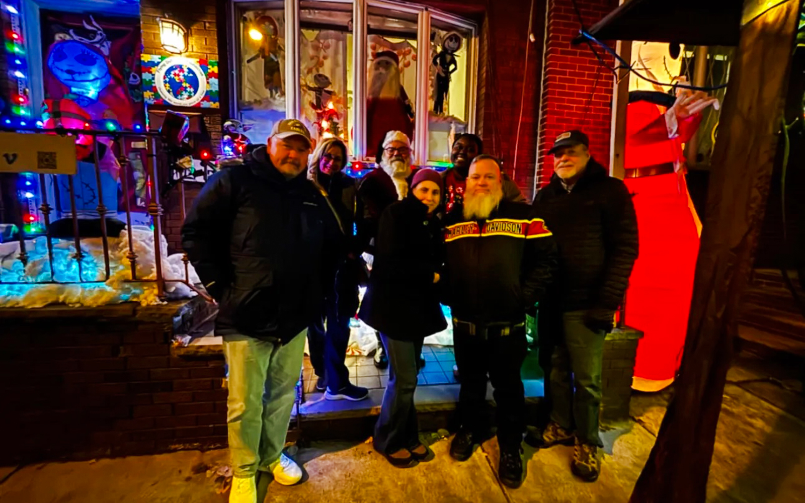 Group enjoying holiday lights display in Philadelphia during a festive tour.