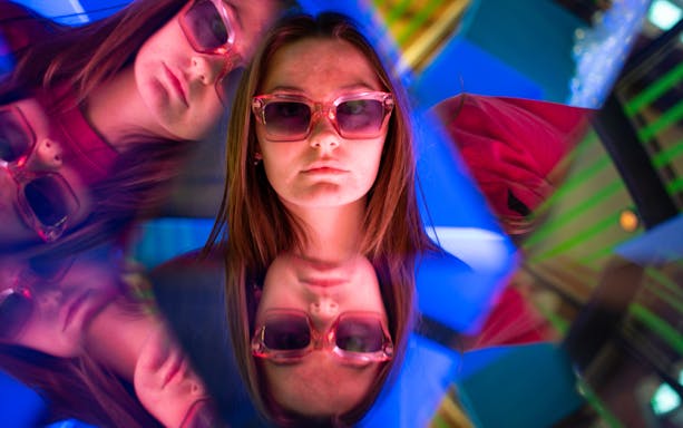 Reflections of a person wearing sunglasses in The TUBE, Copenhagen.