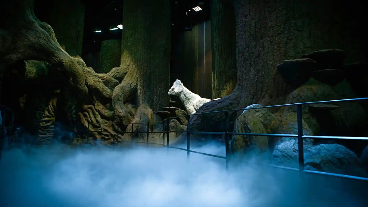Magical forest scene with a white creature at Harry Potter™ Warner Bros. Studio Tour.