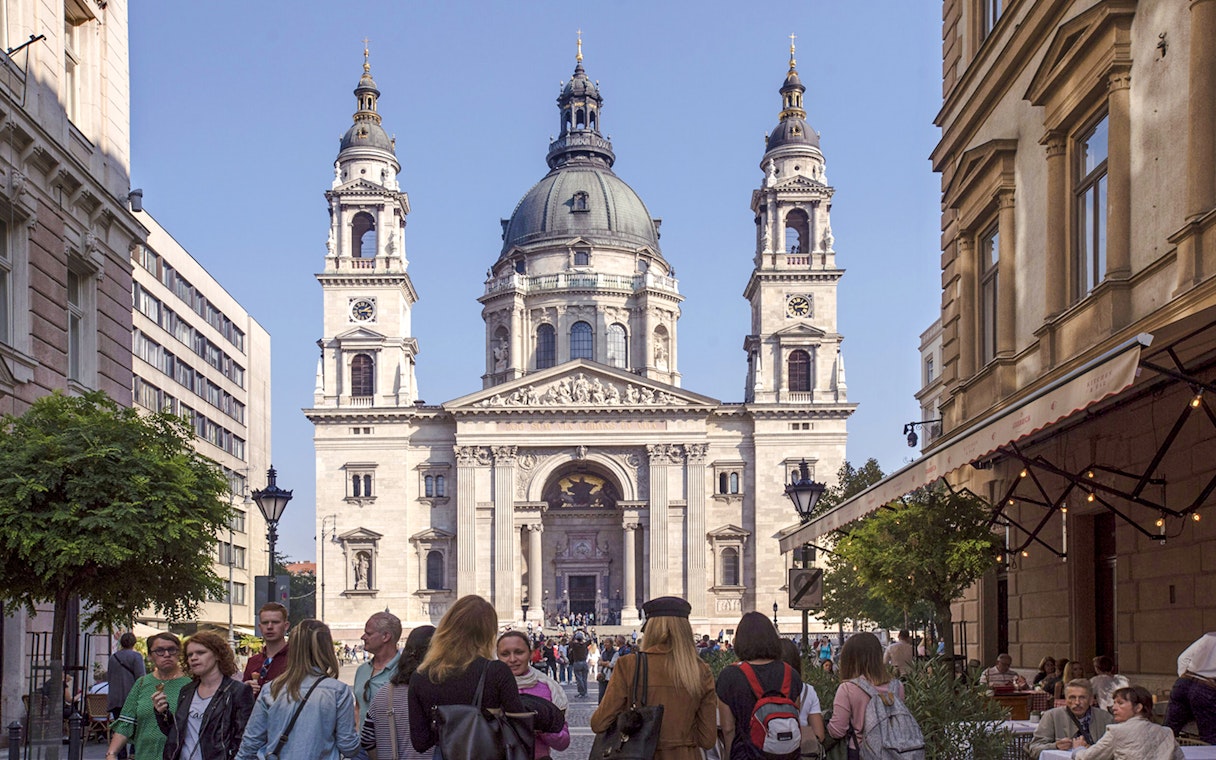 St. Stephen's Basilica facade with tourists during Budapest walking tour.