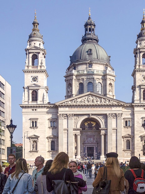 St. Stephen's Basilica facade with tourists during Budapest walking tour.