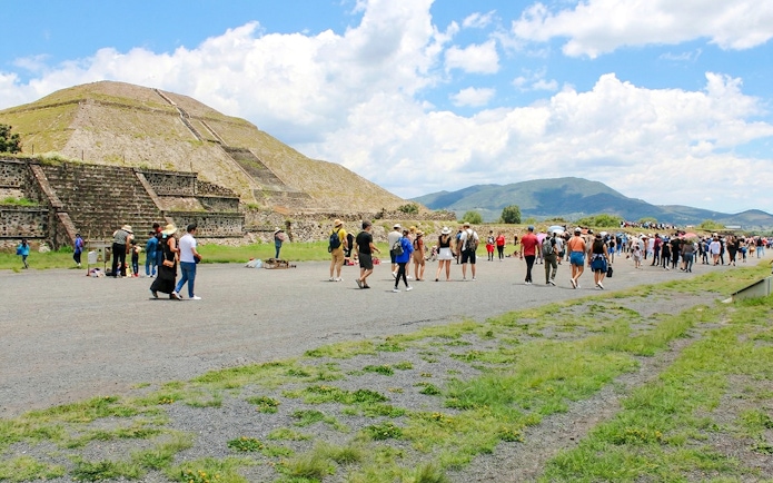 Visitors exploring the Pyramid of the Sun at Teotihuacán, Mexico.
