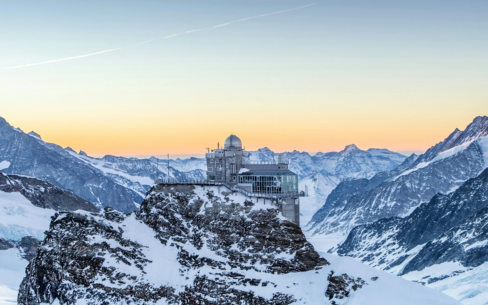 Sphinx Observatory atop Jungfraujoch in Swiss Alps with panoramic mountain views.