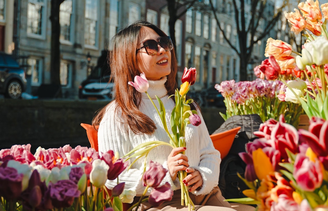 Guests enjoying tulips on a luxury cruise in Amsterdam.