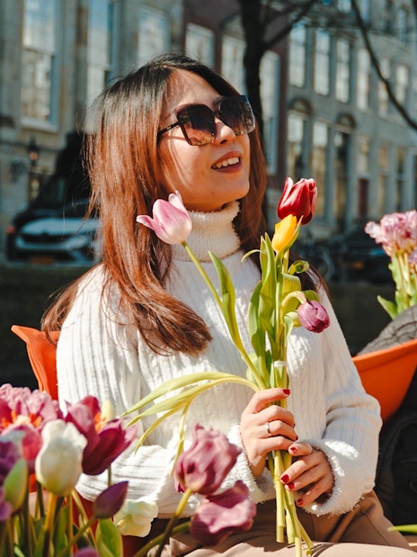 Guests enjoying tulips on a luxury cruise in Amsterdam.