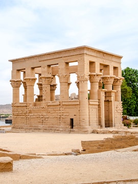 Philae Temple of Isis on Agilkia Island, Lake Nasser, with ancient columns and stone structure.