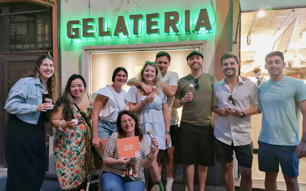 Group enjoying gelato outside a shop during a Trastevere and Campo de Fiori food tour.