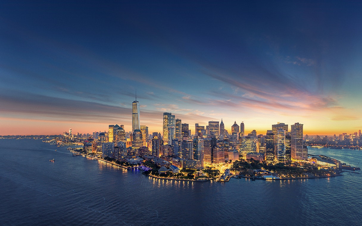 Aerial view of Manhattan skyline at sunset with One World Trade Center.