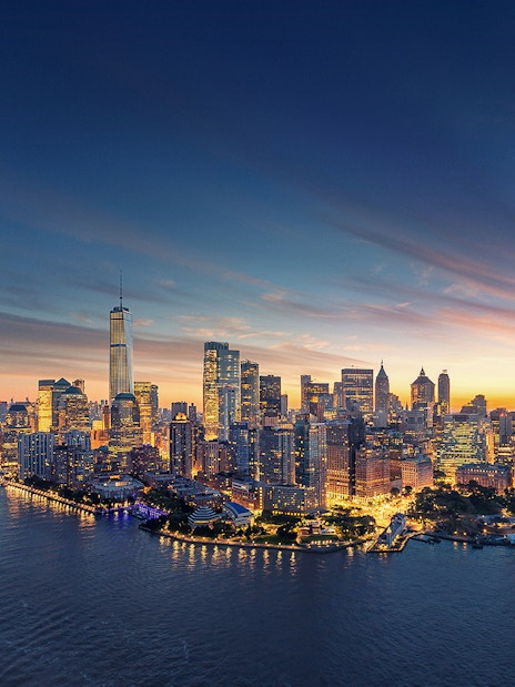 Aerial view of Manhattan skyline at sunset with One World Trade Center.