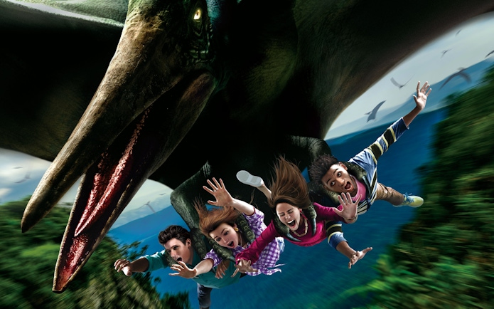 Visitors on a flying dinosaur ride at Universal Studios Japan.