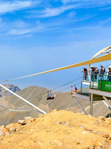 Zipline riders launch from Jebel Jais platform in Ras Al Khaimah, UAE.