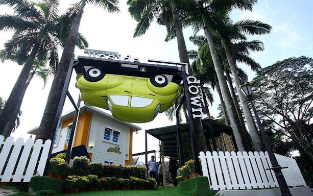 Kuala Lumpur Upside Down House entrance with inverted car display.