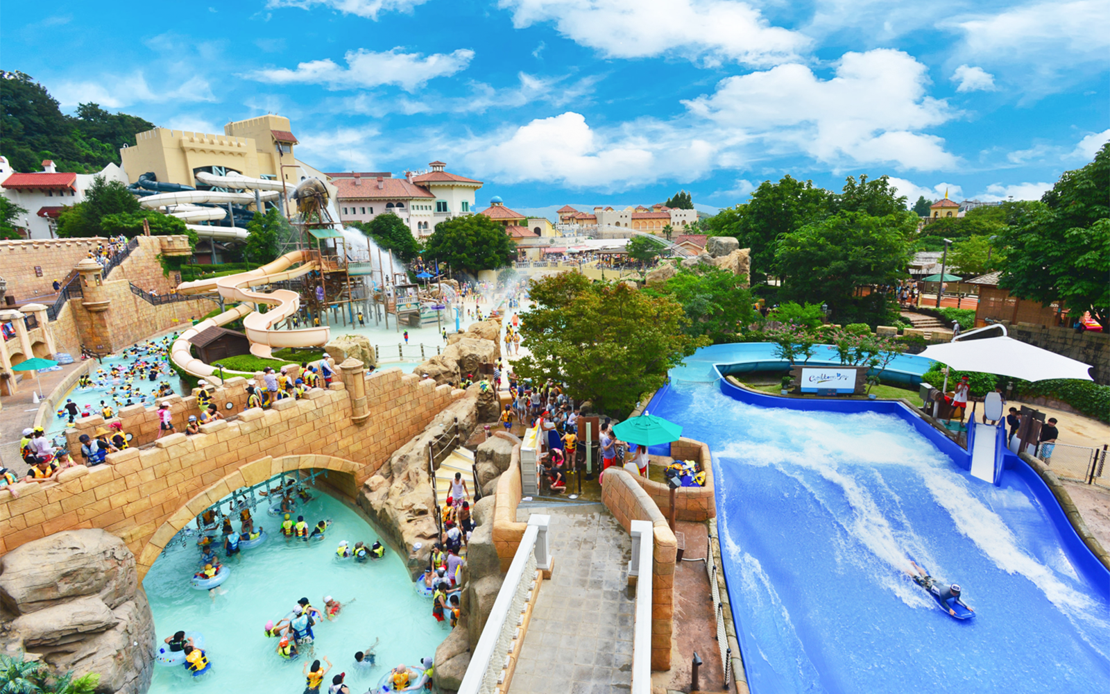 Visitors enjoying slides and lazy river at Caribbean Bay Water Park.