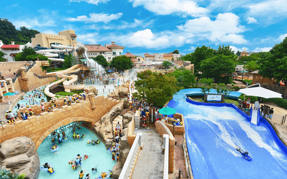 Visitors enjoying slides and lazy river at Caribbean Bay Water Park.