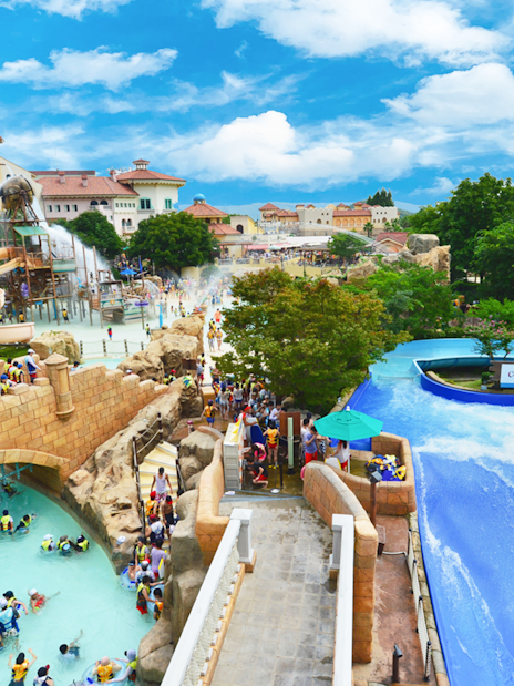 Visitors enjoying slides and lazy river at Caribbean Bay Water Park.