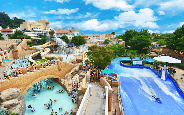 Visitors enjoying slides and lazy river at Caribbean Bay Water Park.