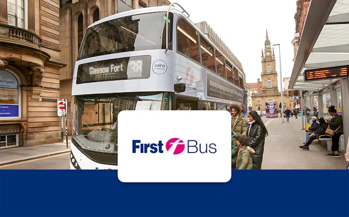 Bus at Glasgow city center stop with passengers boarding, connecting to airport.
