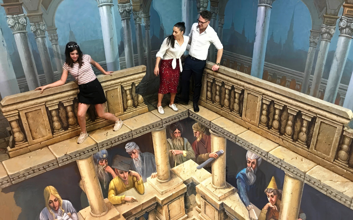Visitors interacting with 3D art at ArtVo Melbourne Trick-Art Gallery.
