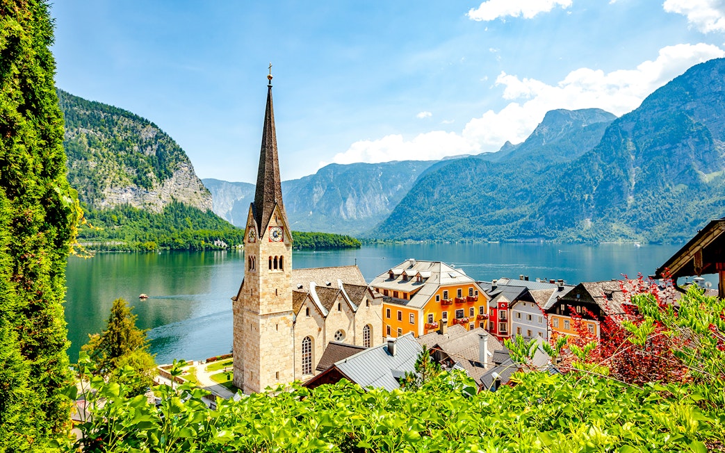 Lakeside village with church and colorful buildings in Hallstatt, Austria.