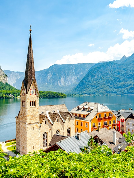 Lakeside village with church and colorful buildings in Hallstatt, Austria.