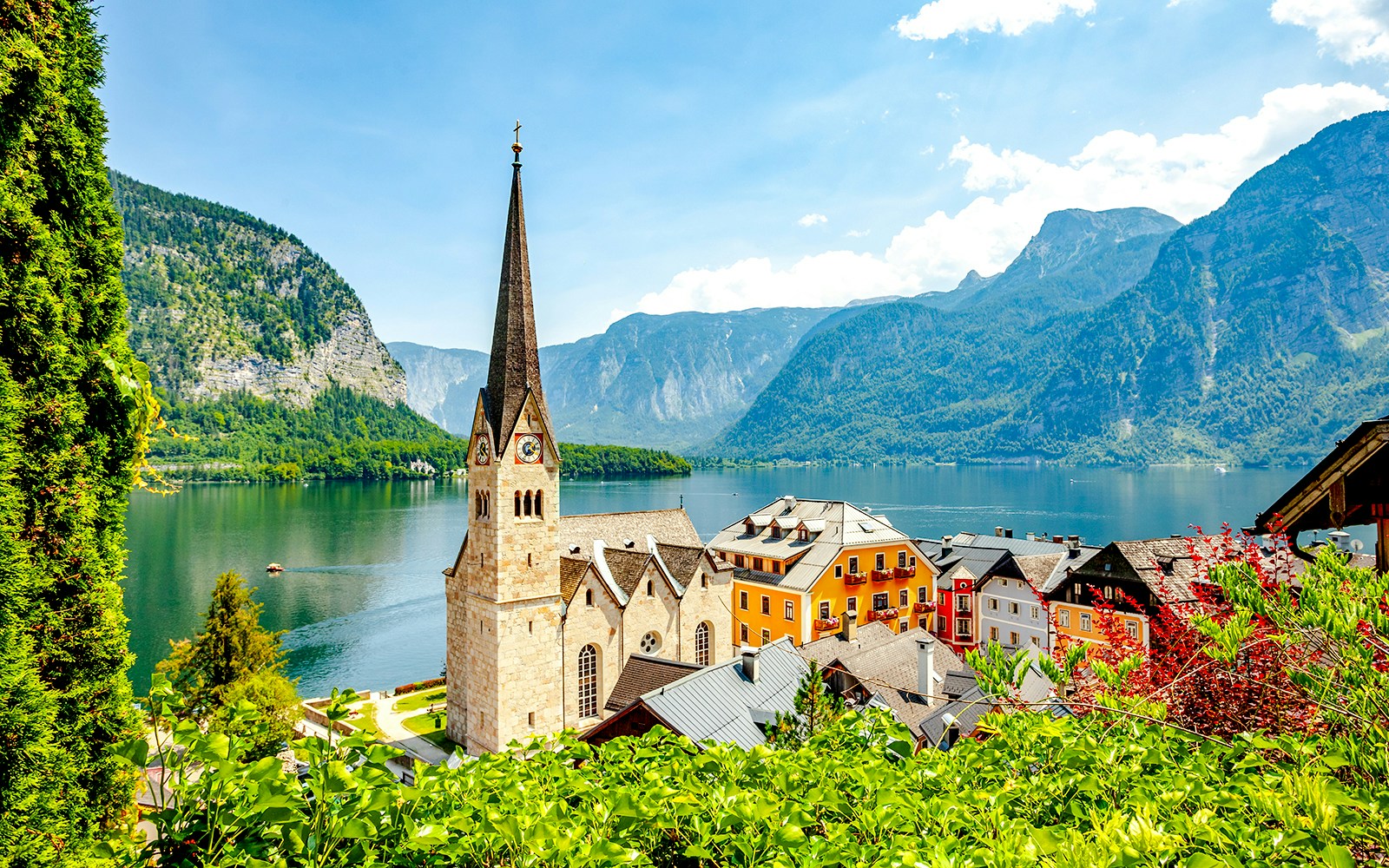 Lakeside village with church and colorful buildings in Hallstatt, Austria.