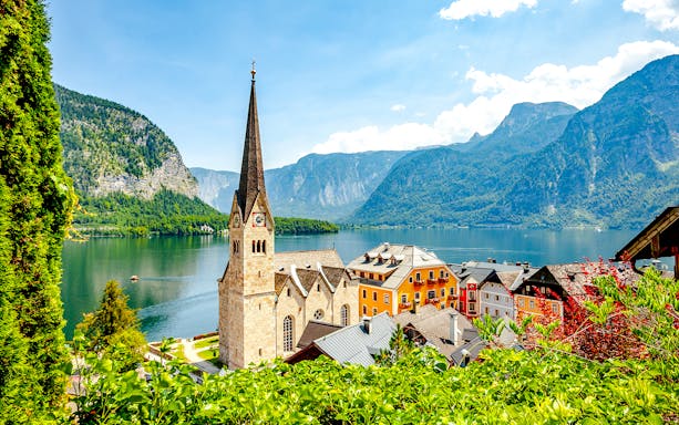 Lakeside village with church and colorful buildings in Hallstatt, Austria.
