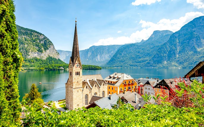 Lakeside village with church and colorful buildings in Hallstatt, Austria.