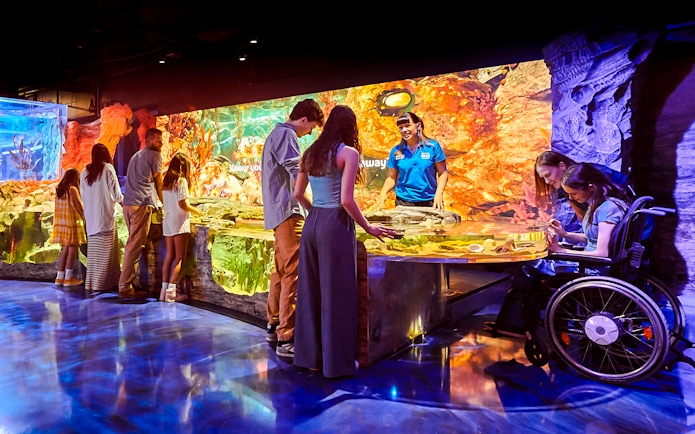Visitors exploring interactive exhibits at Sea Life Melbourne.