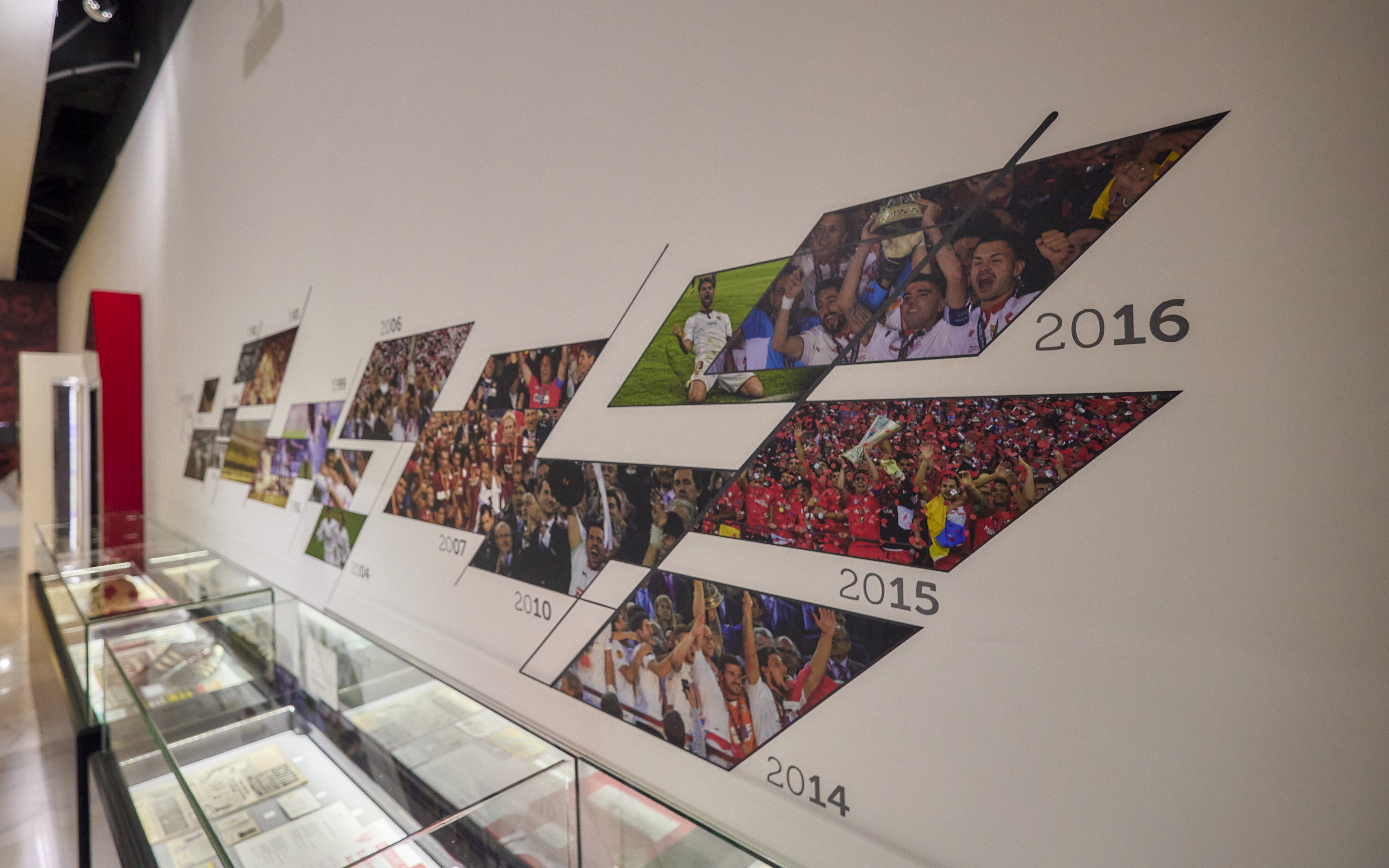 Sevilla FC History Experience museum timeline display with team achievements.