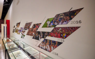 Sevilla FC History Experience museum timeline display with team achievements.