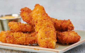 Crispy chicken tenders on a plate at Hard Rock Cafe, Amsterdam.