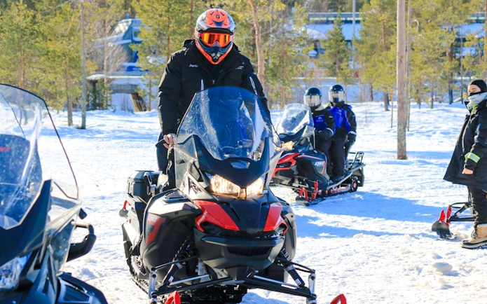 Snowmobilers preparing for a 2.5-hour safari adventure in Rovaniemi.