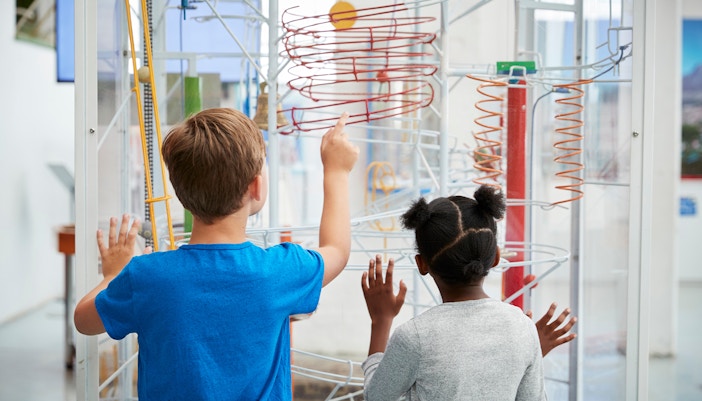 Children exploring interactive exhibit at NEMO Science Museum, Amsterdam.