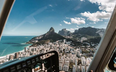 Aerial view from a helicopter of Rio de Janeiro's coastline and Dois Irmãos peaks in Leblon and Ipanema.