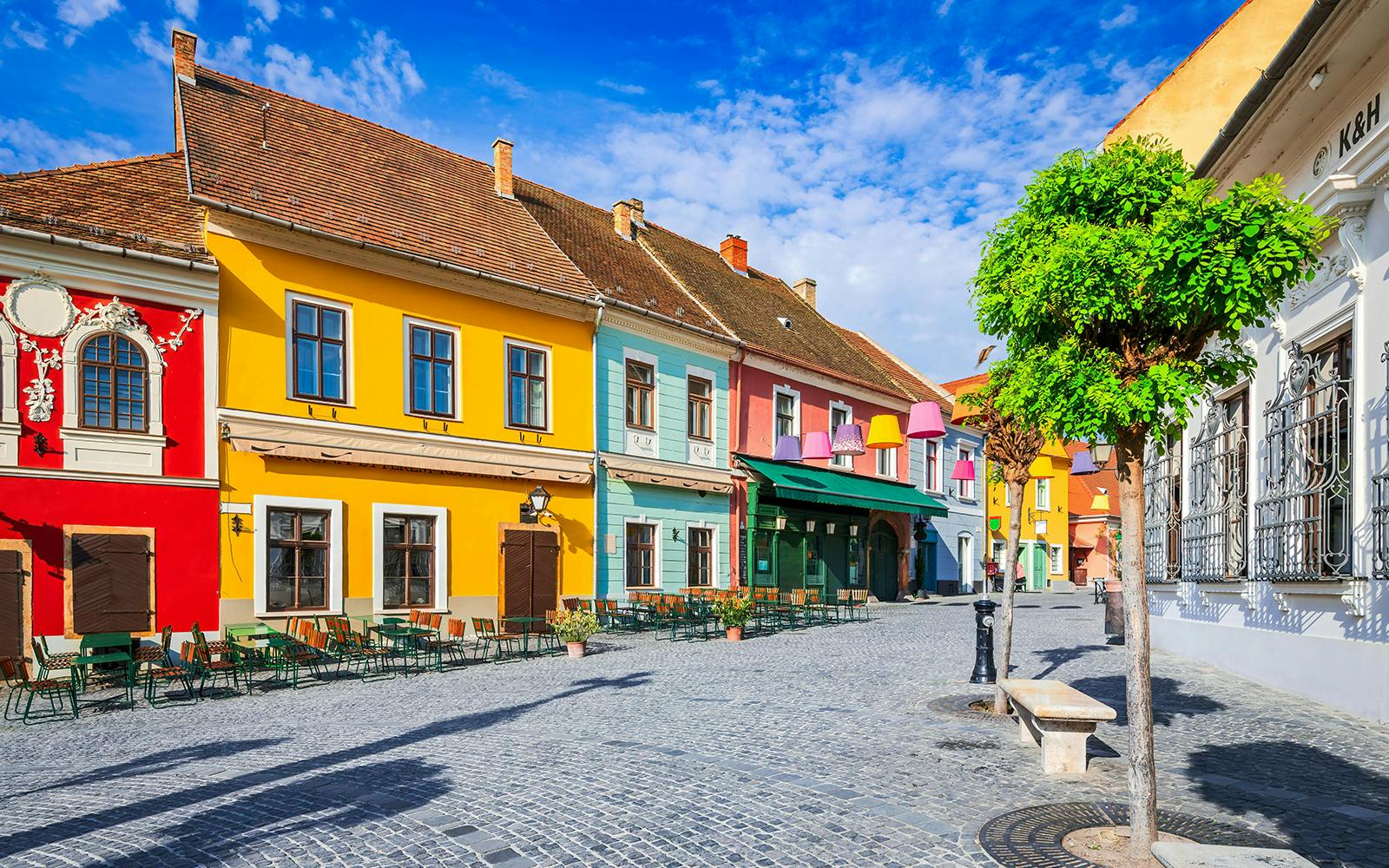 Cobbled street with colorful buildings in Szentendre, Hungary.