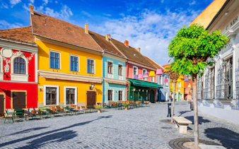 Cobbled street with colorful buildings in Szentendre, Hungary.