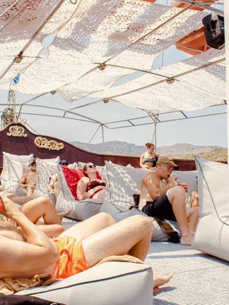 Guests relaxing and drinking on a day cruise from Rhodes.