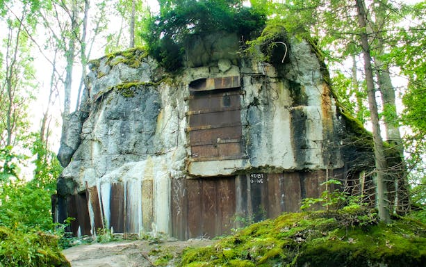 Wolf’s Lair bunker entrance surrounded by forest in Poland.