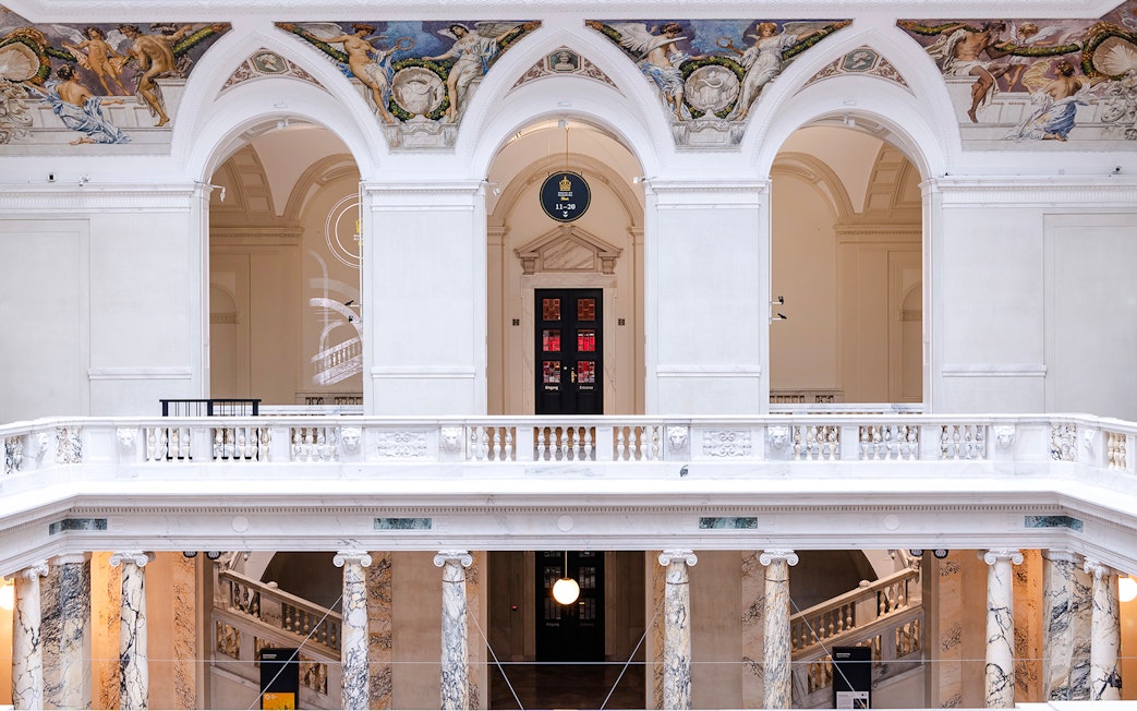 Interior arches and frescoes of New Hofburg Palace, Vienna, Austria.