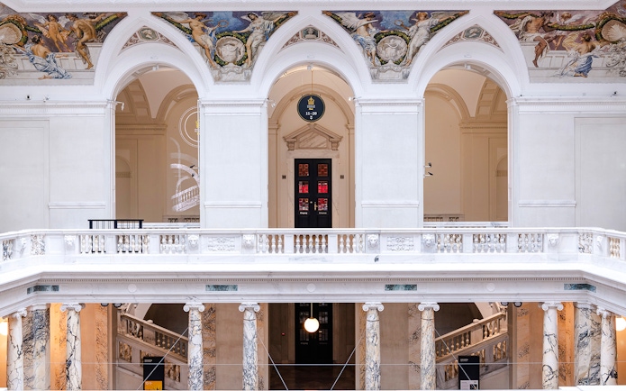 Interior arches and frescoes of New Hofburg Palace, Vienna, Austria.