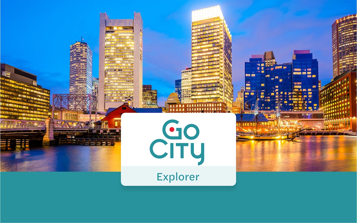 Boston skyline at dusk with Go City Explorer Pass logo.