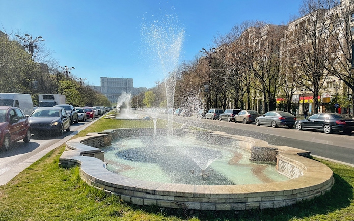 Fountains along Fountains Avenue with the Palace of Parliament in the background, Bucharest.